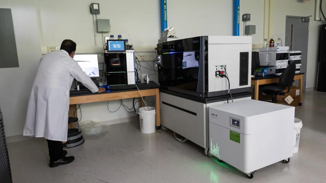 scientist using mass spectrometry technology