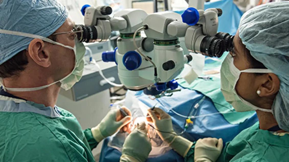 two surgeons operating