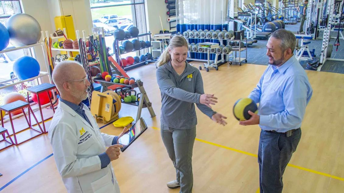Doctors stands to record observations in the neuro sport training excersises 