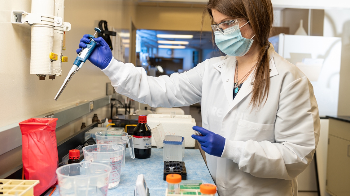 young woman working in lab, retrieving data