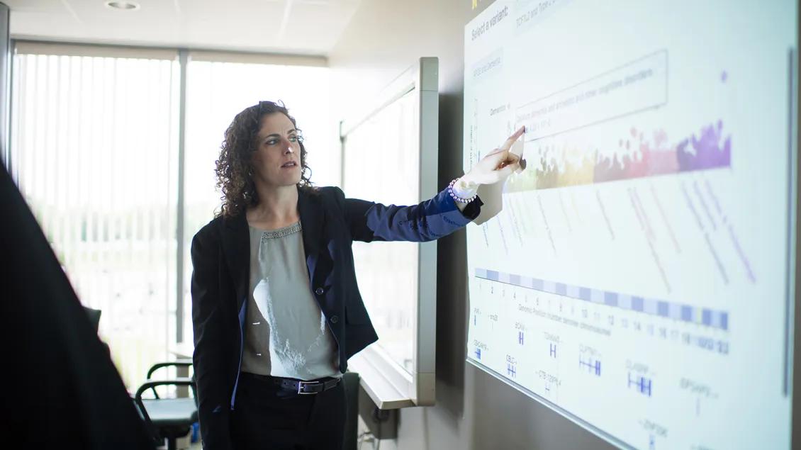 Photo of Victoria Blanc presenting information about a study