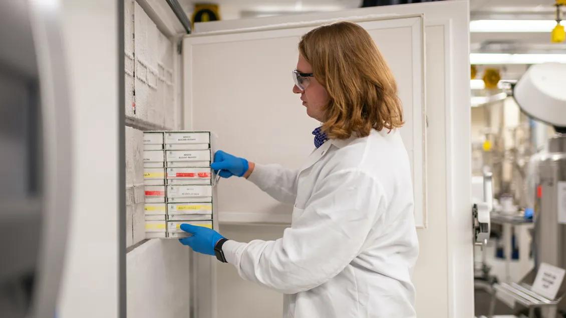 Photo of biospecimen being pulled out of a freezer