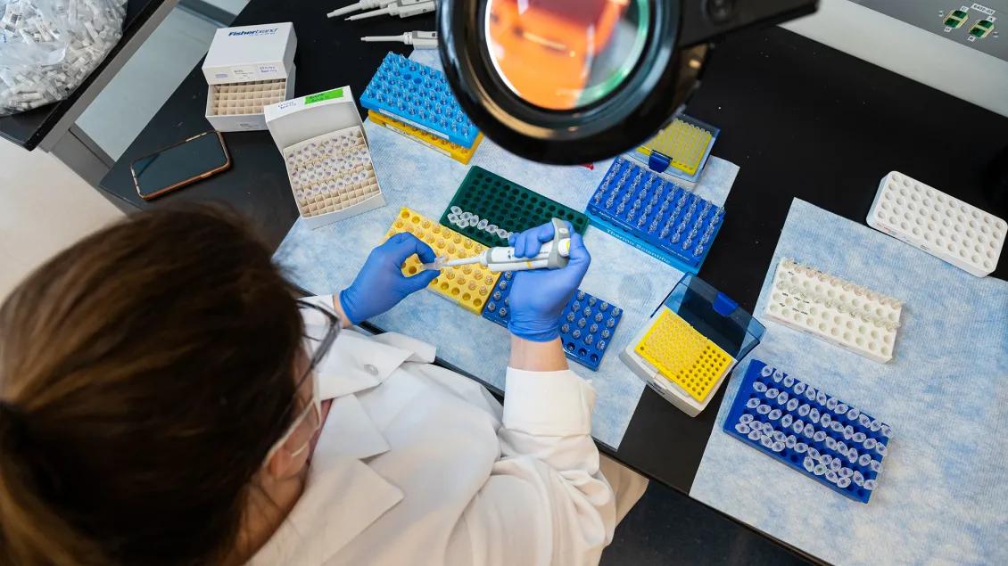 Photo taken from above of a female researcher in the Metabolomics Core