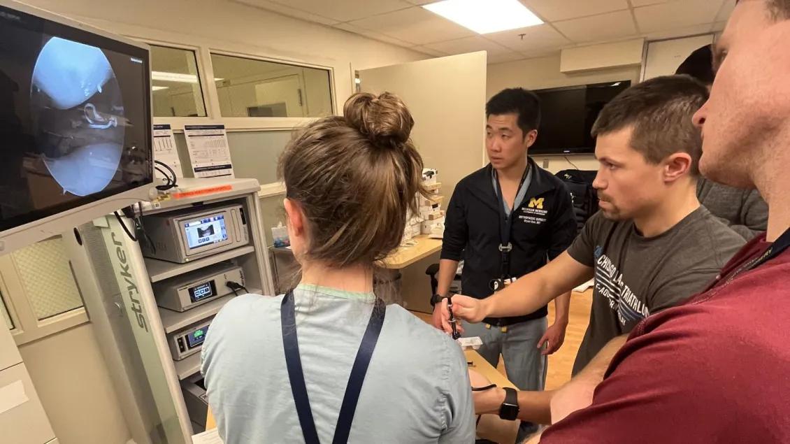 simulation using scope on patient with many student viewers