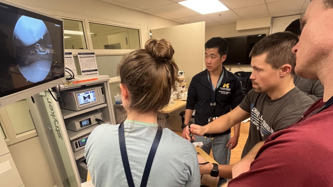simulation using scope on patient with many student viewers