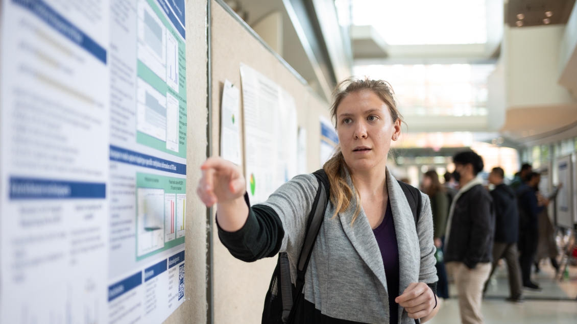 girl explaining a poster