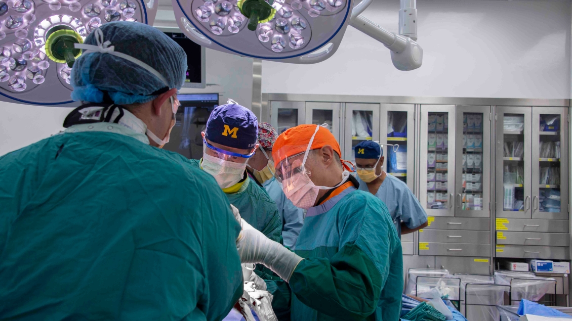 a group of surgeons in a operating room