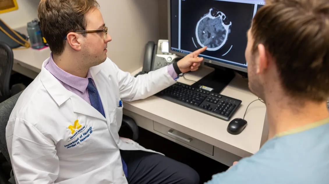 researcher describing scan on computer