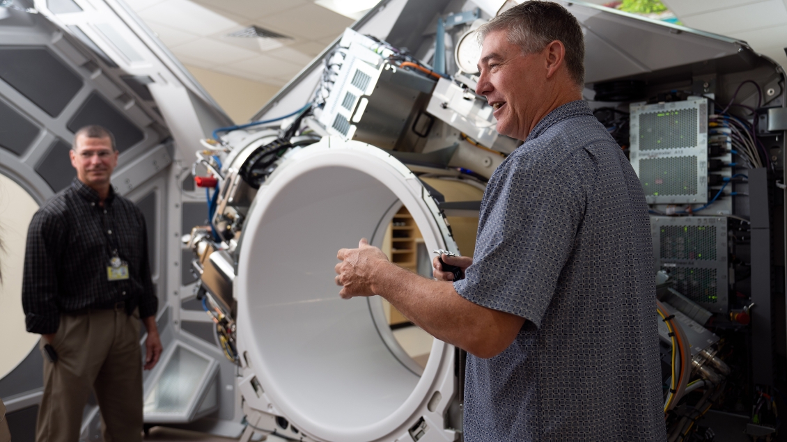 Radiation Oncology staff shows a large machine