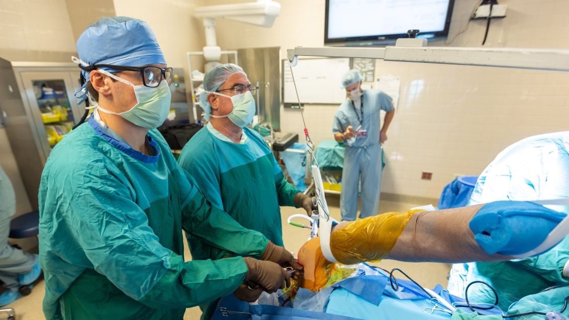 a group of surgeons in a surgery room