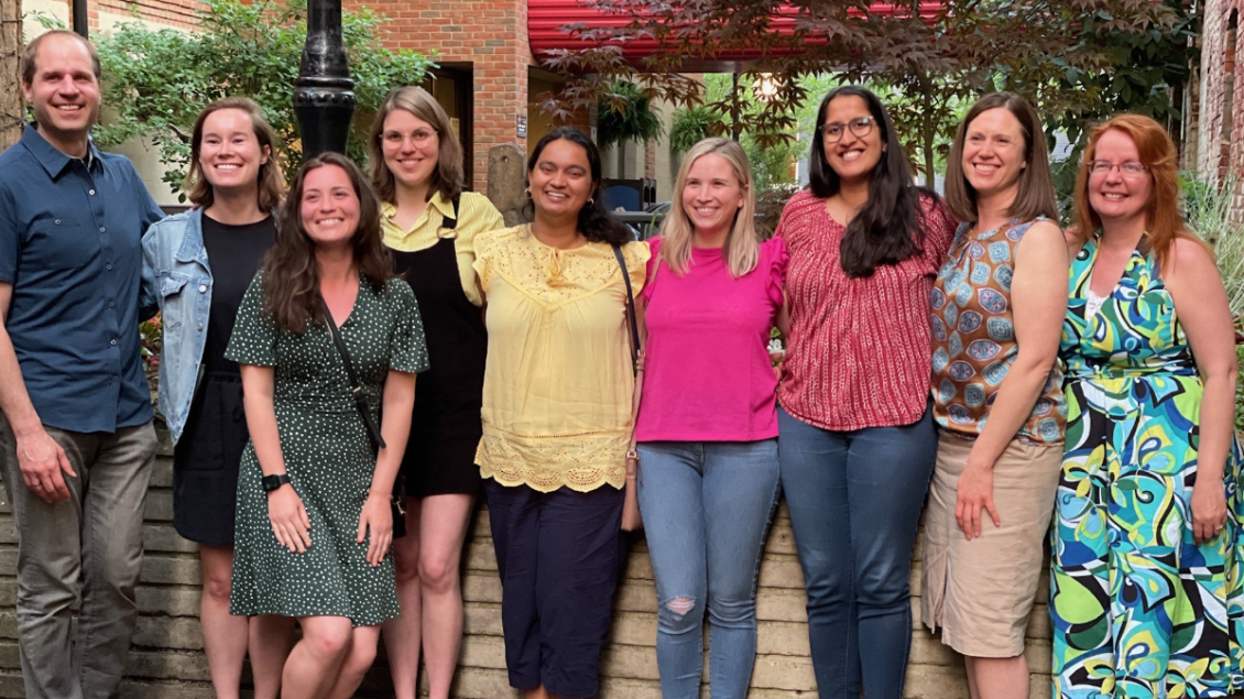 neurology residents pose for a photo outside a restaurant