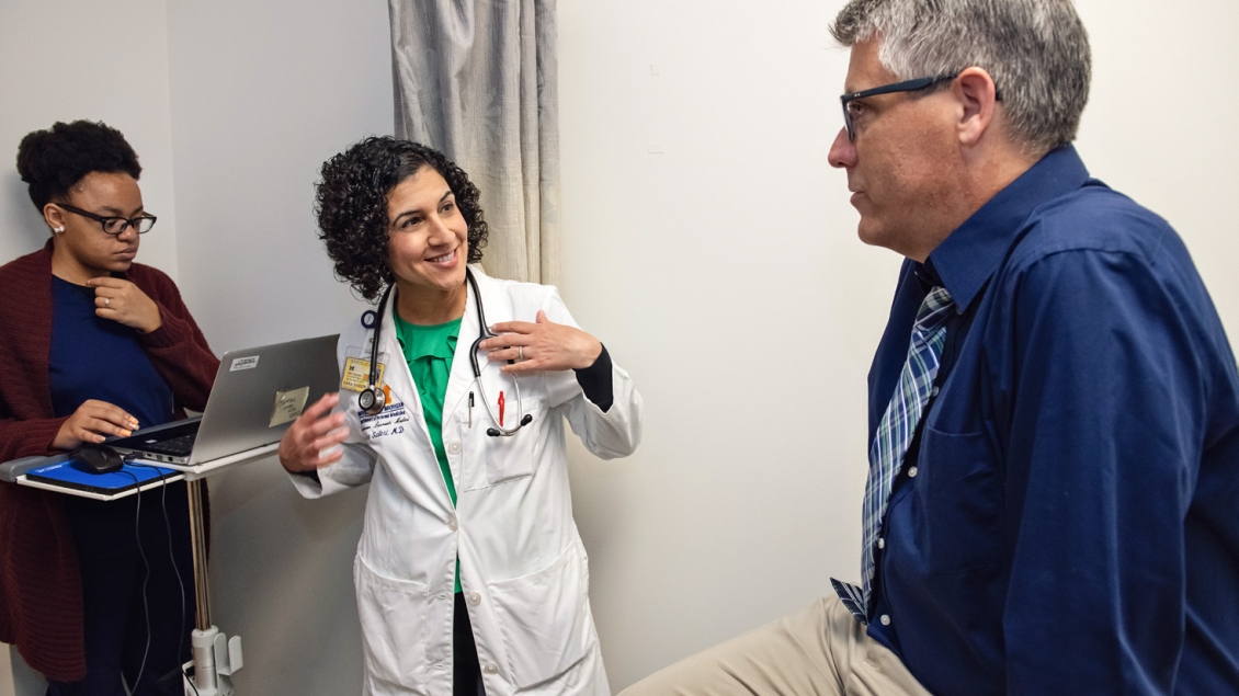 A female physician speaks with a patient