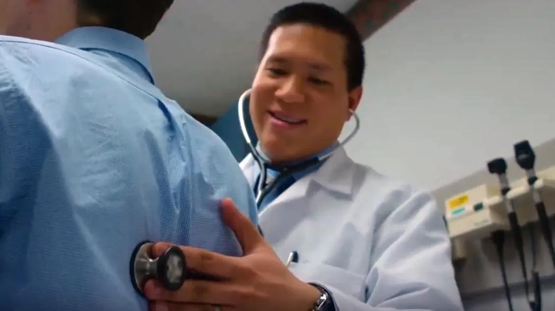 A doctor checking on a patient