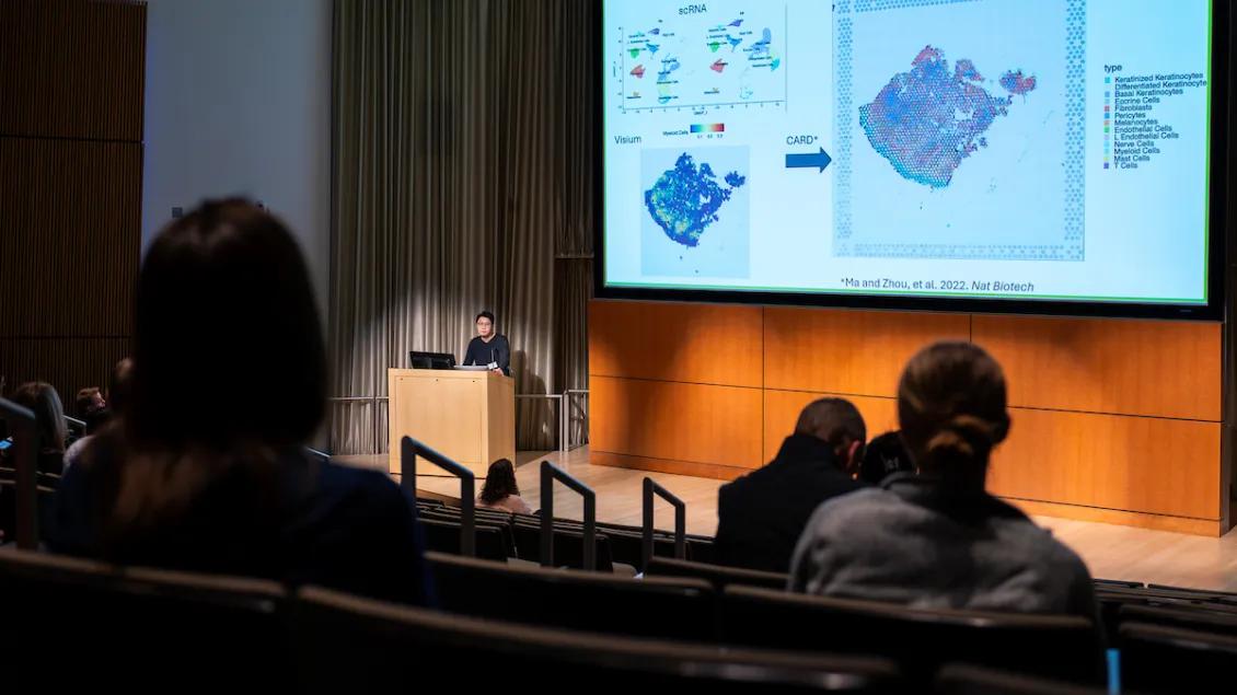 Presenter in the auditorium at the Skin Bio Symposium 2024