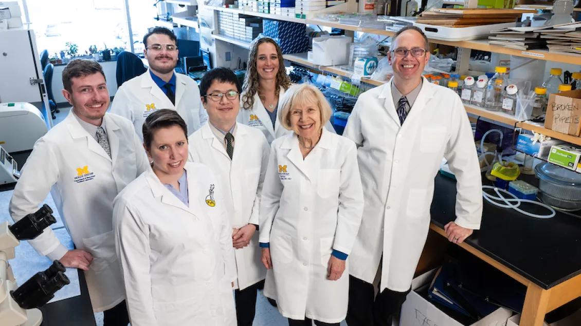 Neuronetwork team in white lab coats