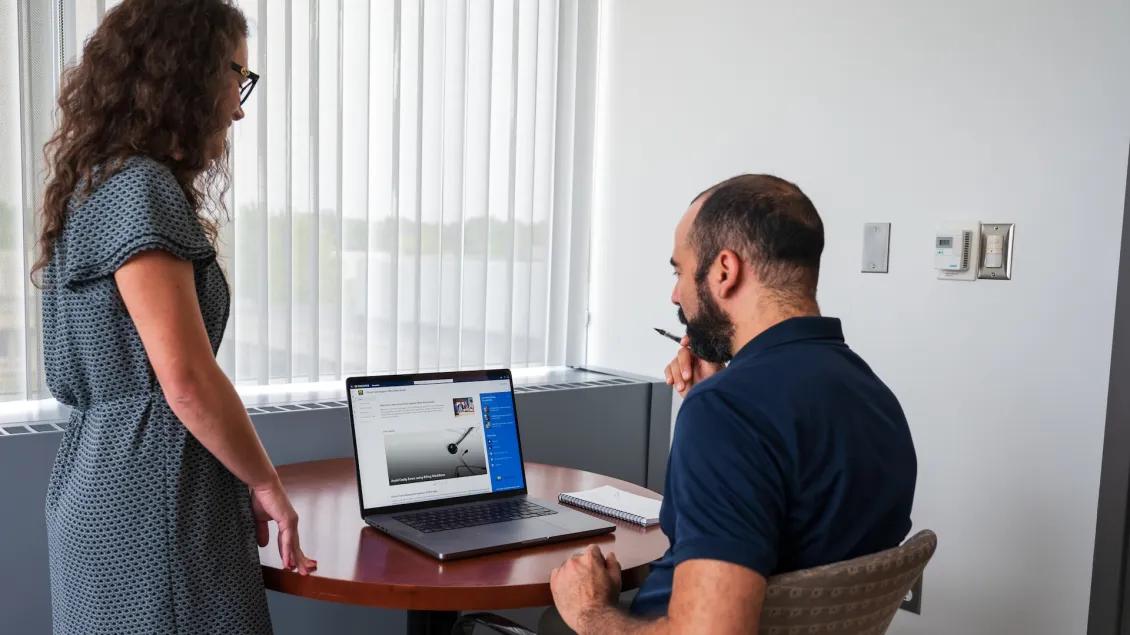 Two people in an office during a data consultation