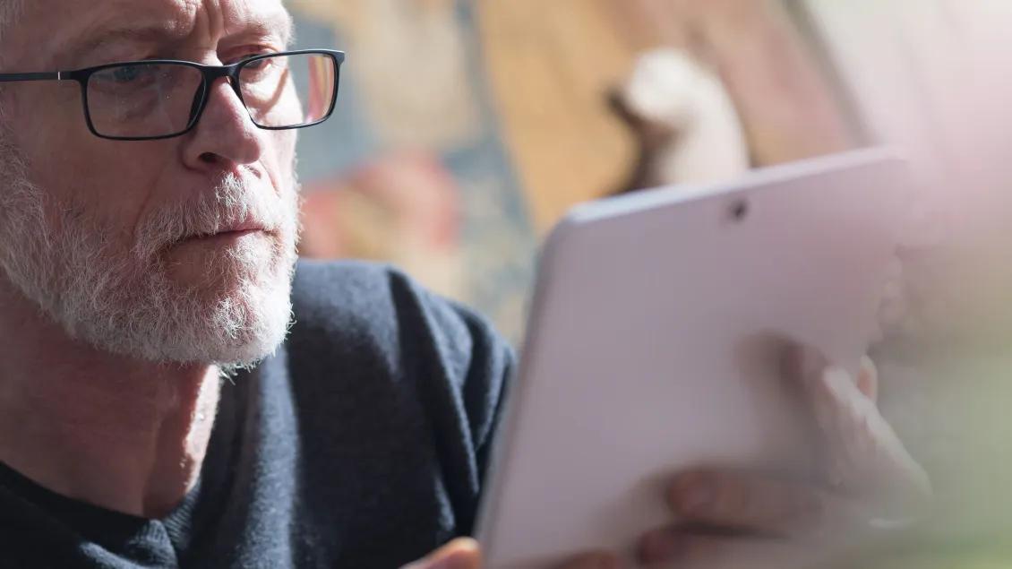 Man looking at tablet