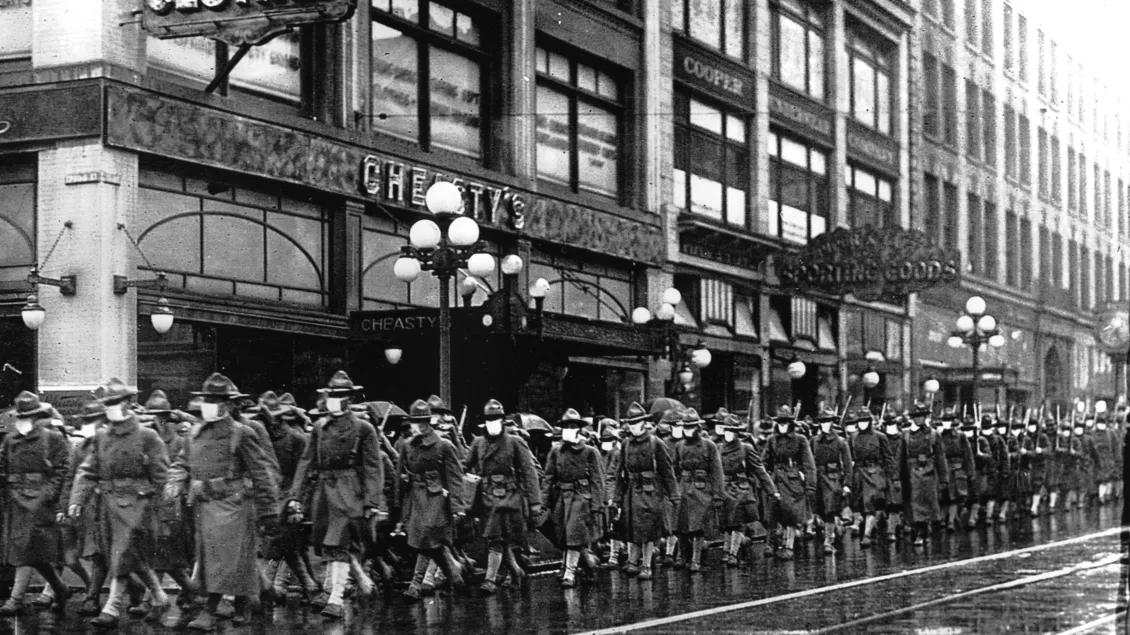 A line of officers during an old influenza breakout