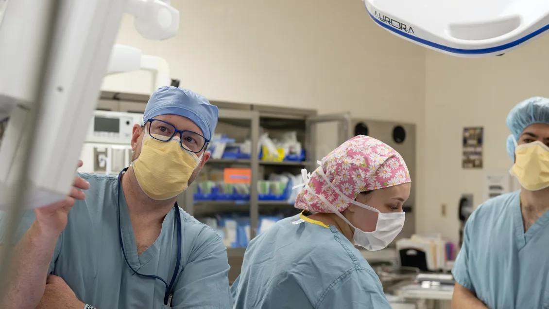 doctors looking at screen during operation 