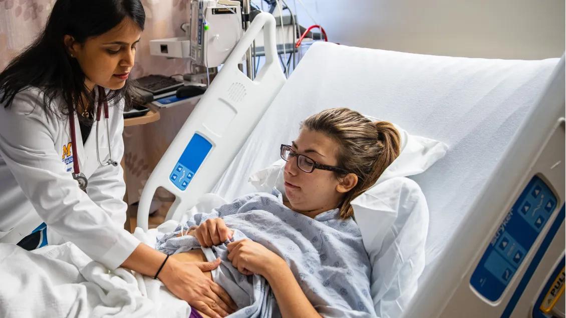 A doctor working with a patient