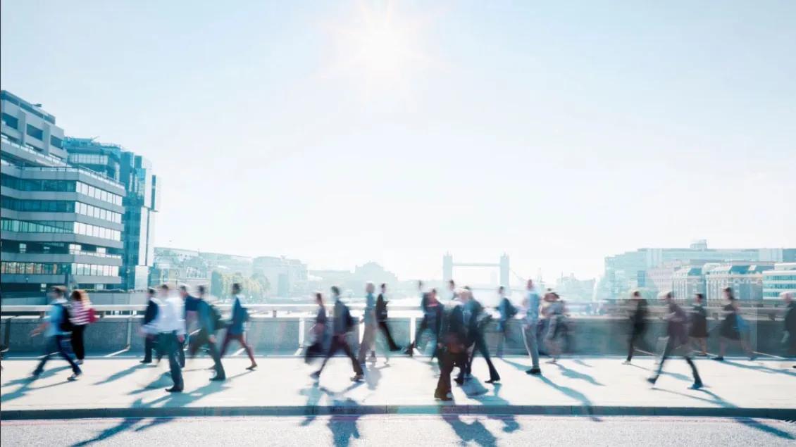 People Walking in London with the Tower Bridge in the background