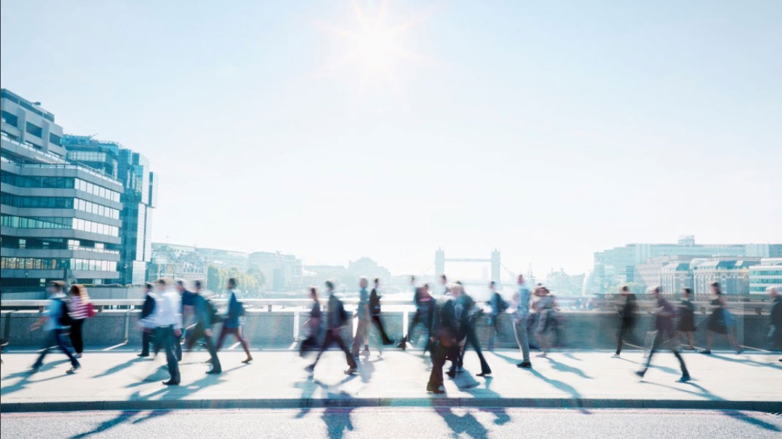 People Walking in London with the Tower Bridge in the background