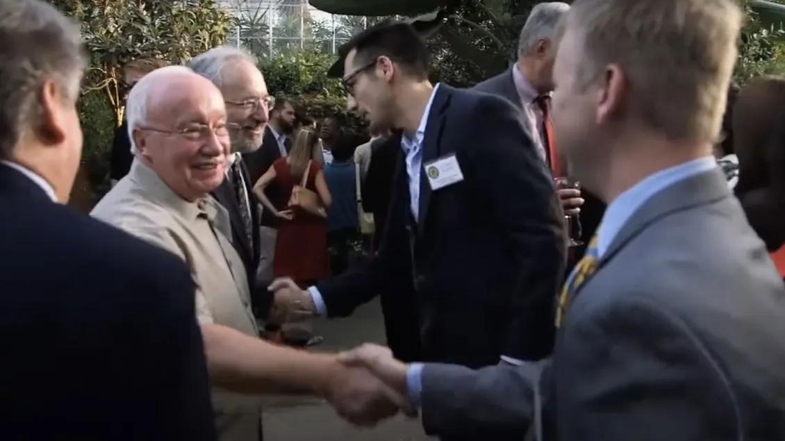 Shaking hands at the TBI Summit