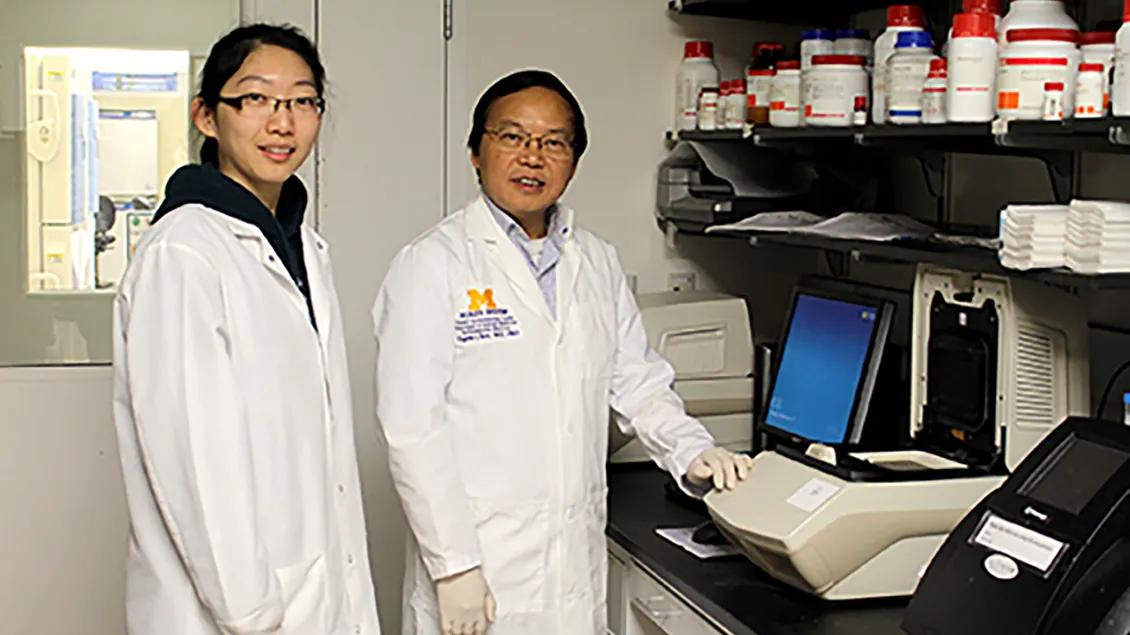 two people standing in a lab