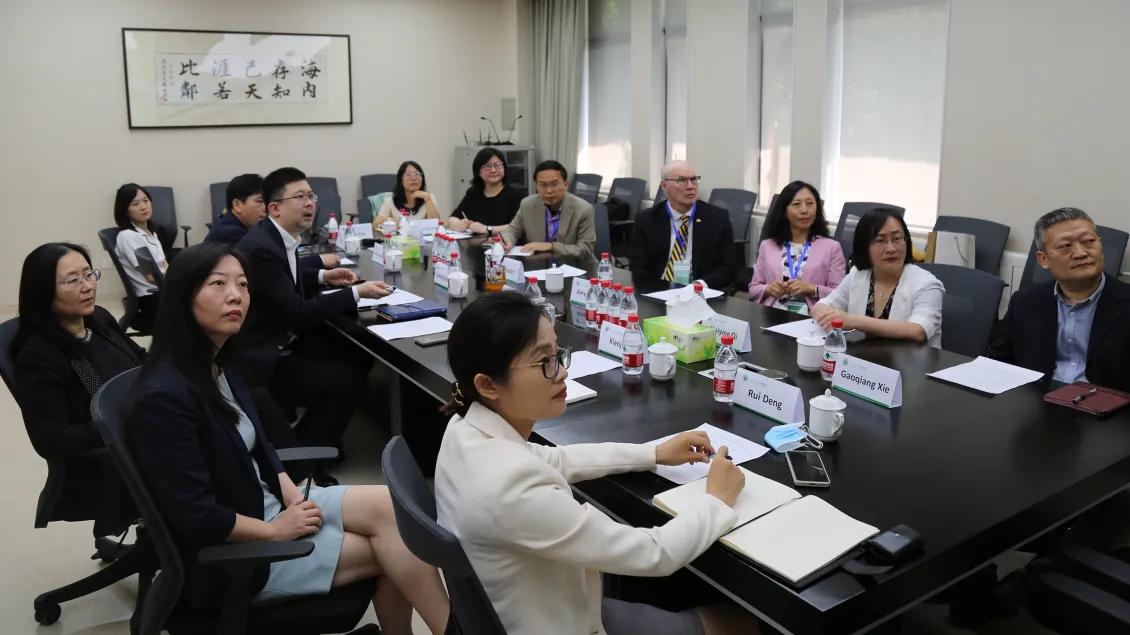 larger group of people in a conference room