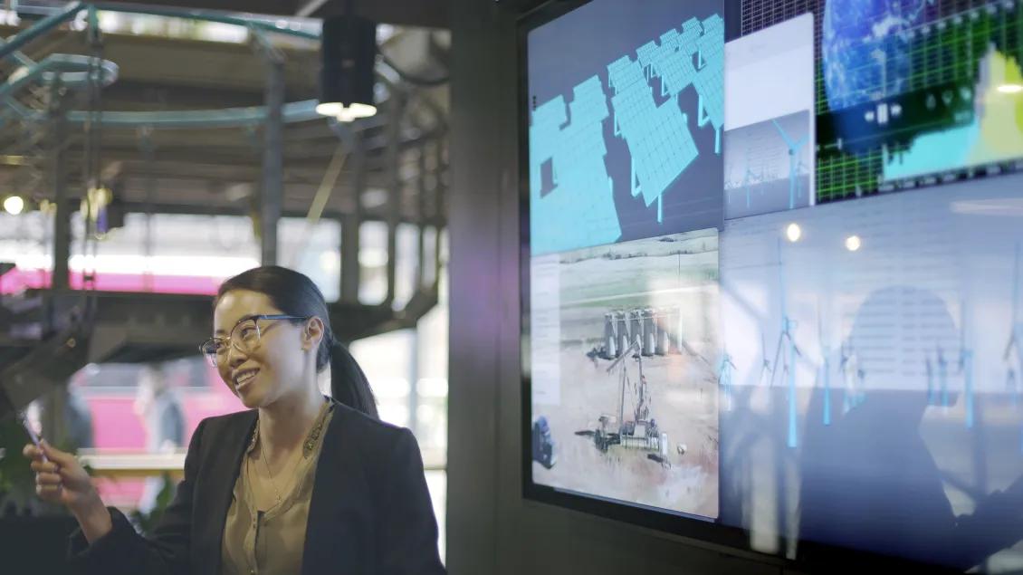 woman presenting images on a digital screen