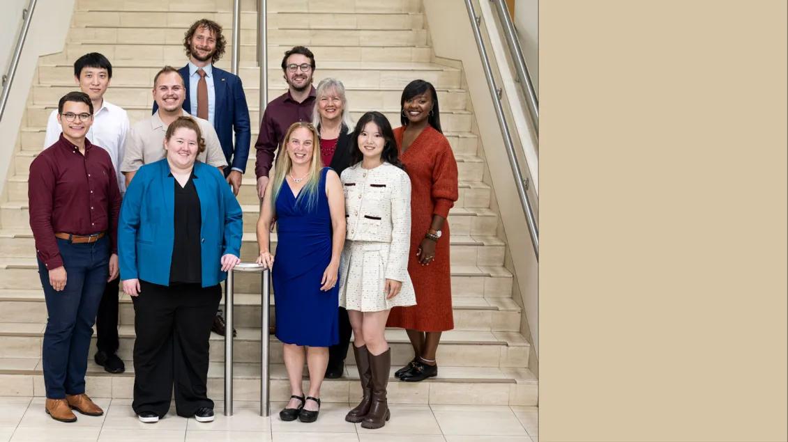 Center for Clinical Outcomes Development & Application Team possing on a stair
