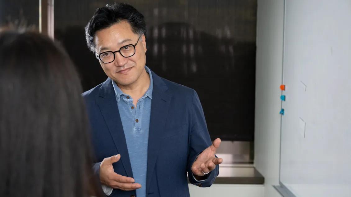 man speaking to woman