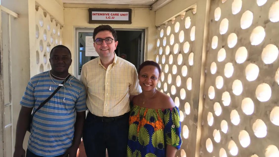 three people standing outside of the ICU