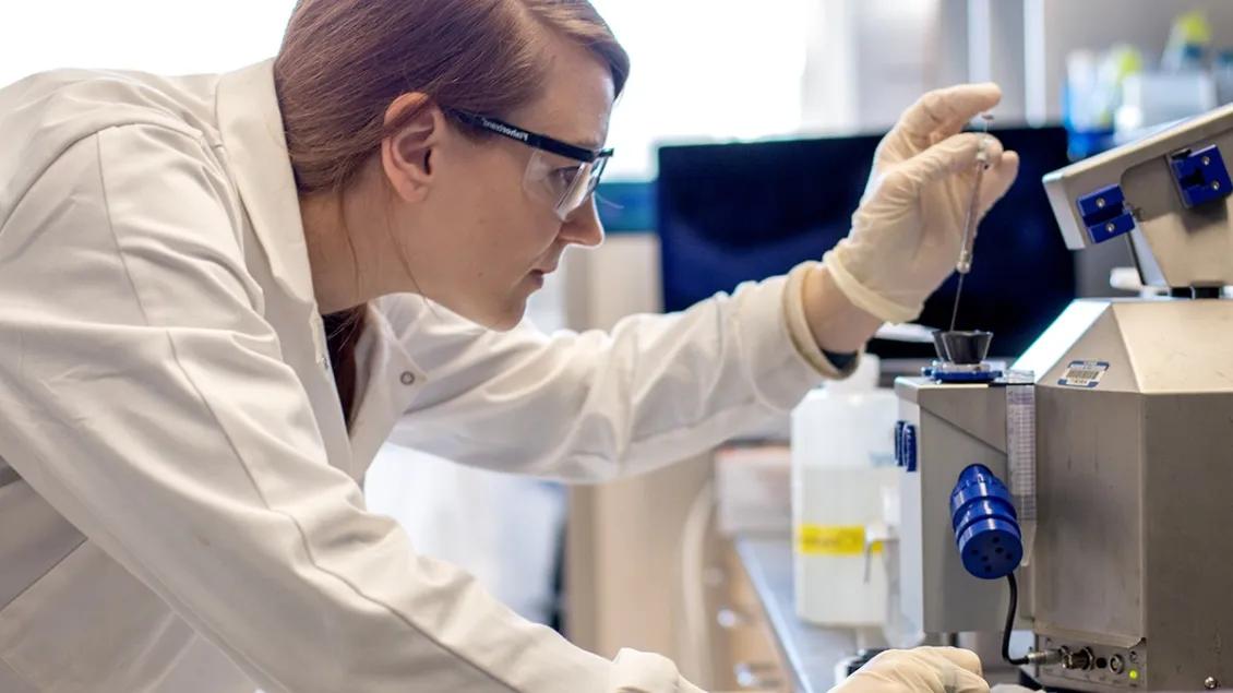 A person working with lab equipment
