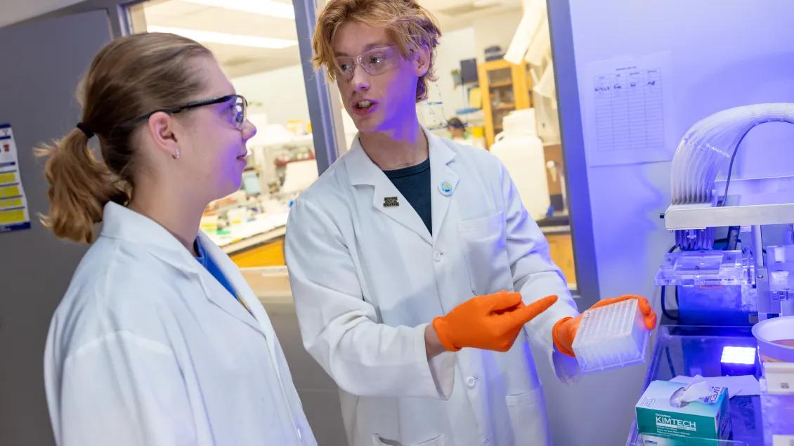 two young techs in a lab