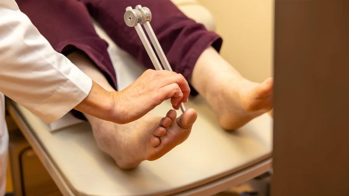 close-up image of a doctor inspecting a patient's foot