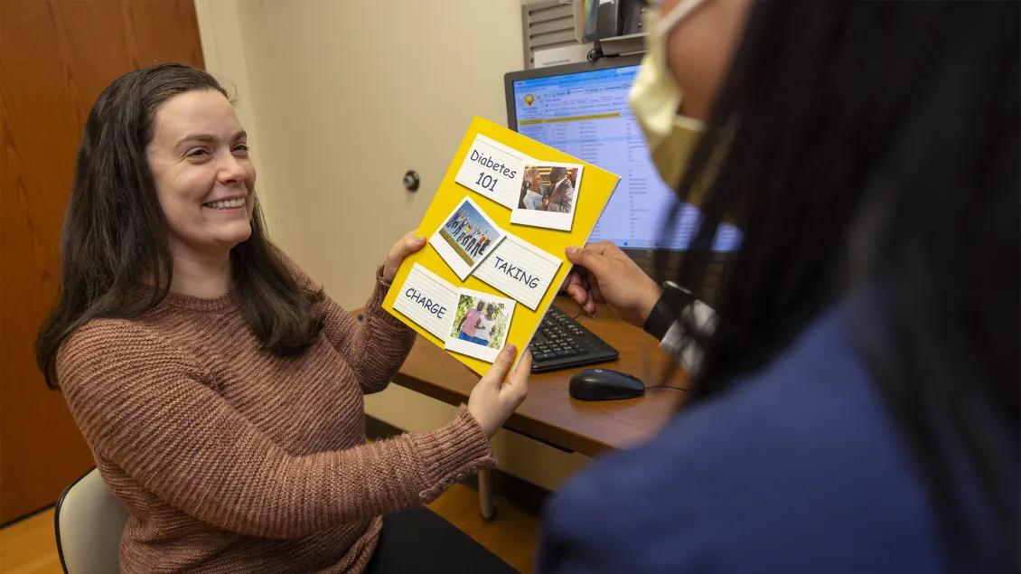 two woman looking at health information