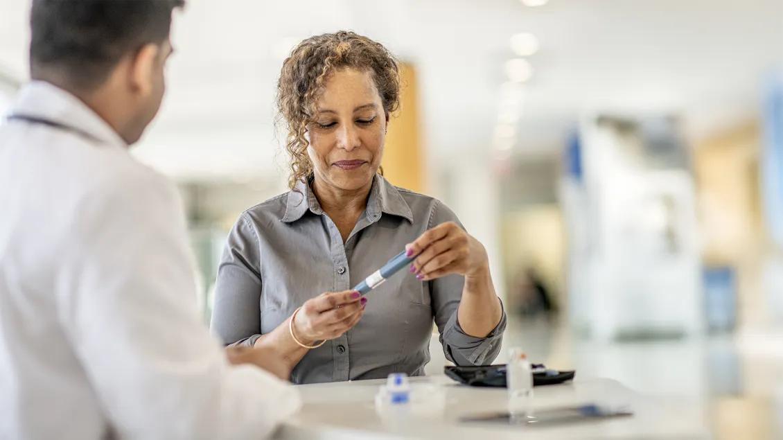 woman speaking with doctor