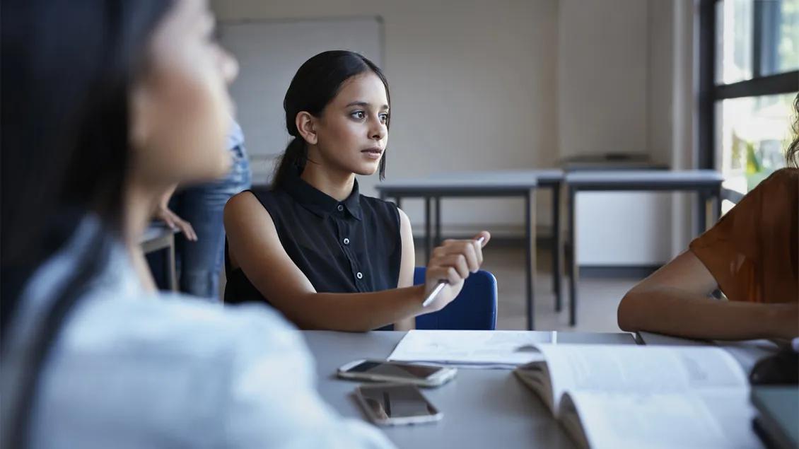 two people talking in a meeting