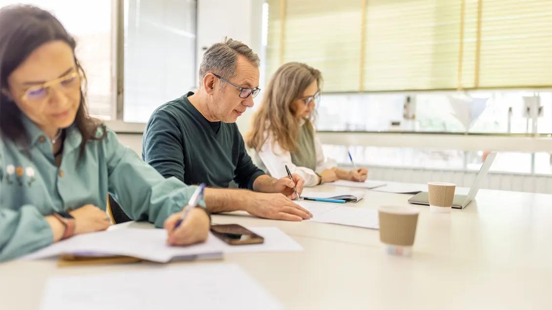 three professionals in an education class