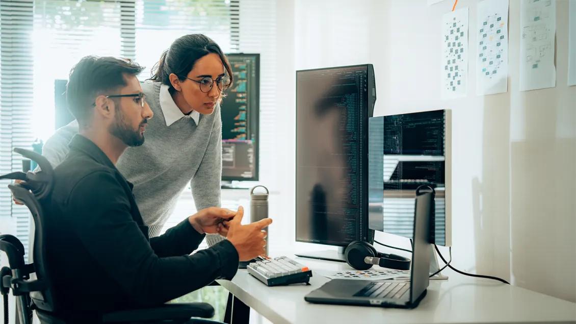 two people working at a computer