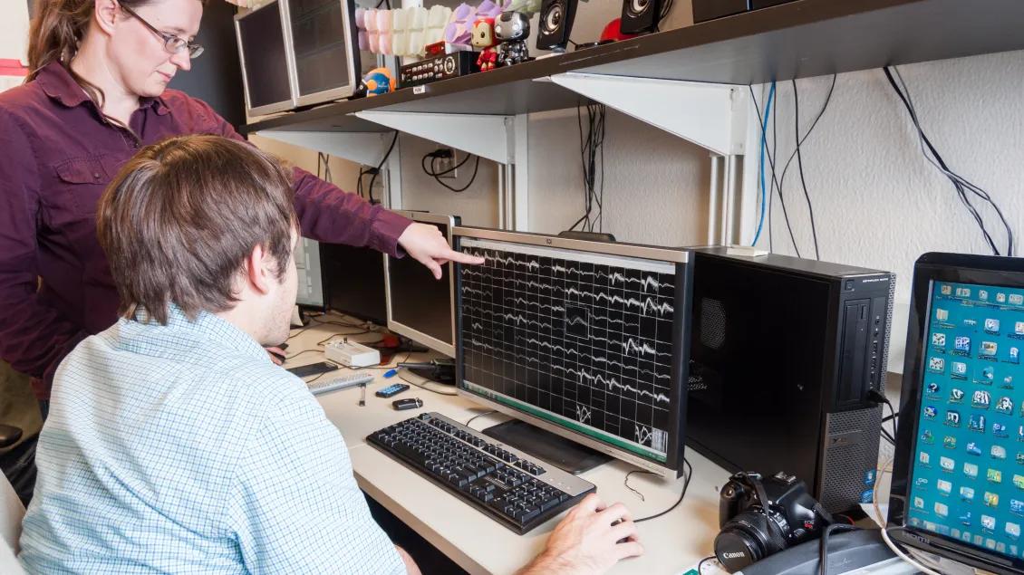 two people working at a computer