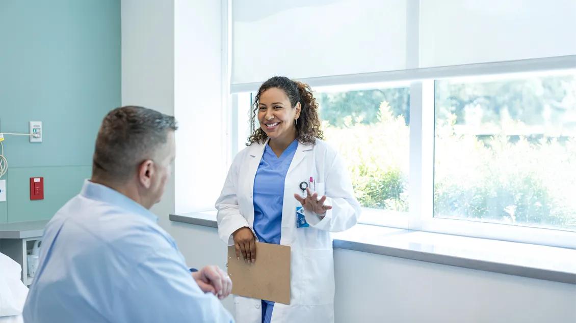 patient and doctor speaking in medical room