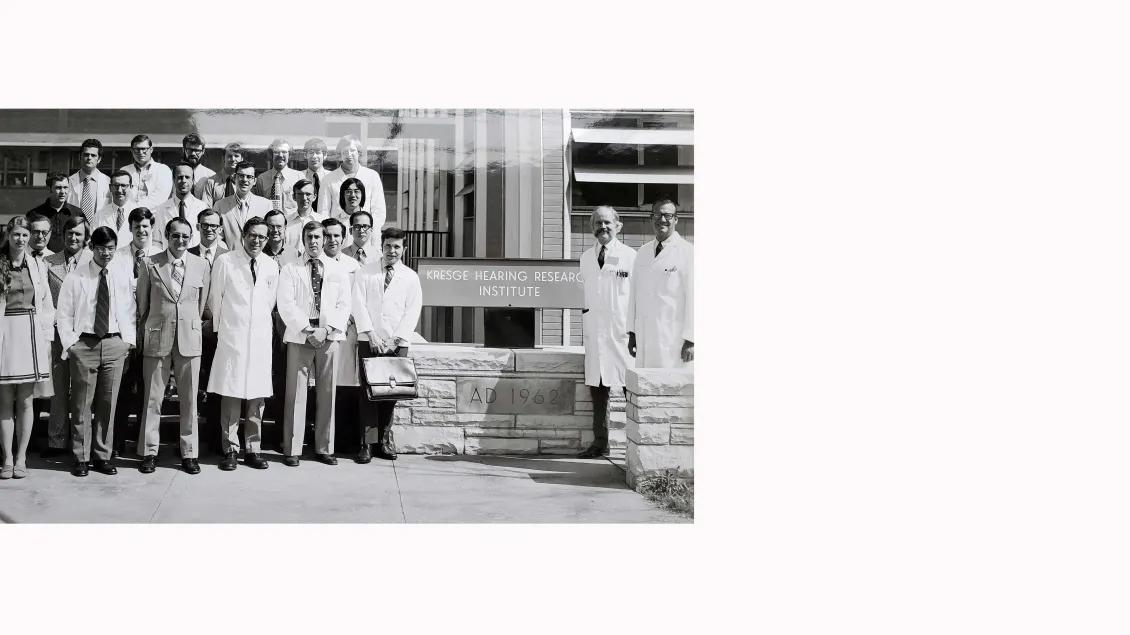 Historical Greoup Photo of Members of KHRI standing in front of building sign