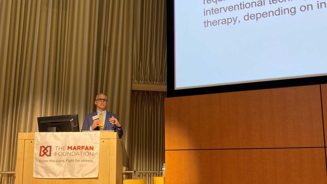 Lecturer presents Eliason Seminar in large conference room