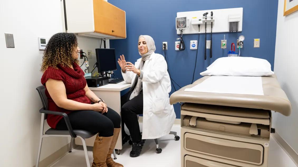 Doctor talking to patient in a clinic