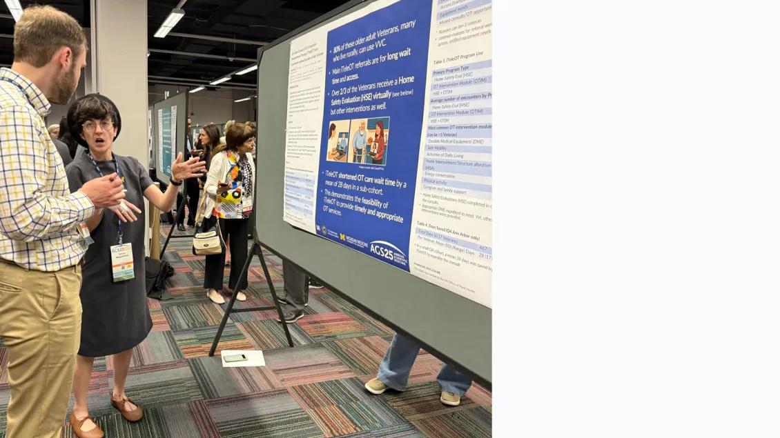 Geriatrics center researcher explaining poster at ACS Conference