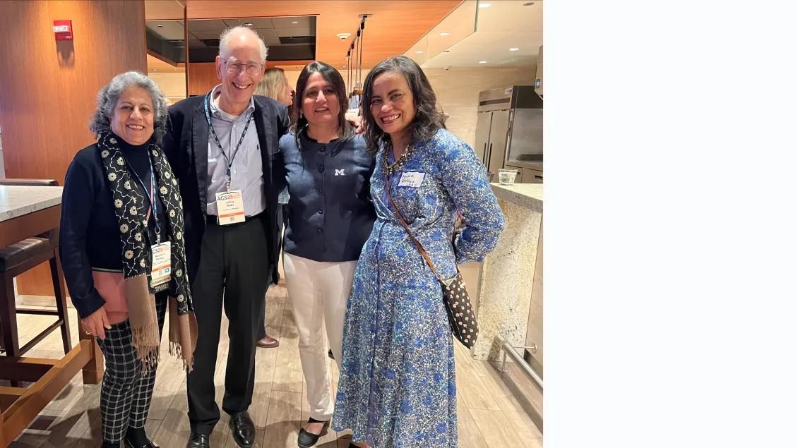 Current and former researchers from the Geriatrics Center meet at a conference.