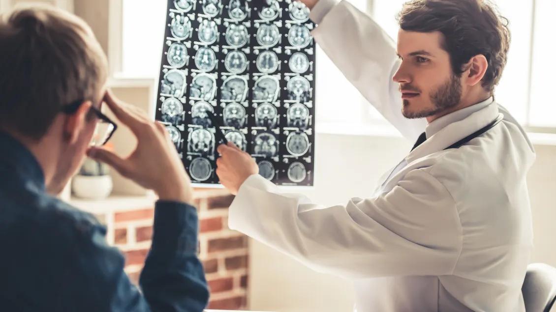 CODA Man Holding MRI Results