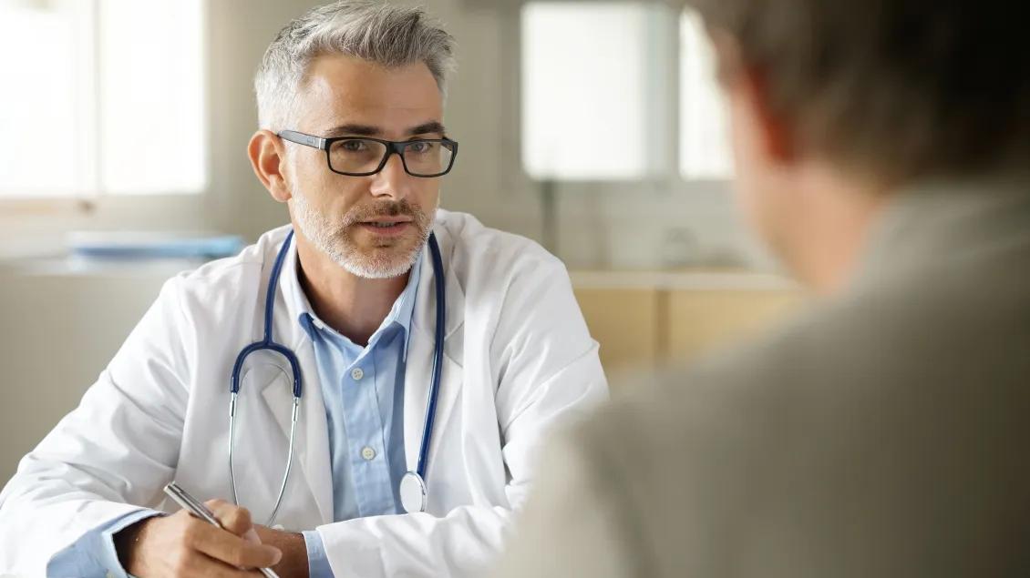 Doctor talking with his patient